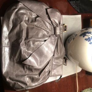 Grey Hobo Bag. Oversized Bow detail.Inside pockets
